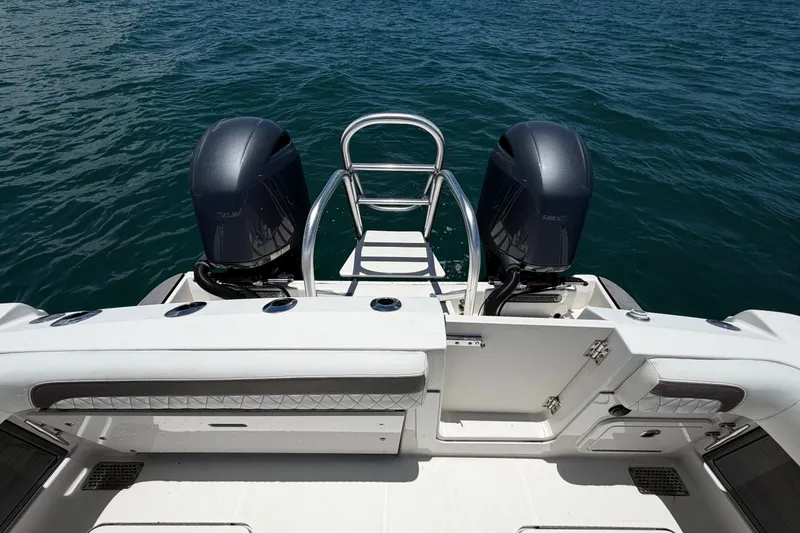 Slide: The Image of 2023 World Cat 280 CC-X boat with dual engines on open water. - 7