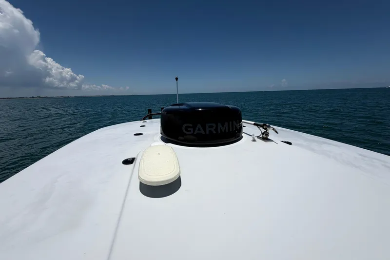 Slide: The Image of Bow view of 2023 World Cat 280 CC-X boat on open sea under clear sky. - 10