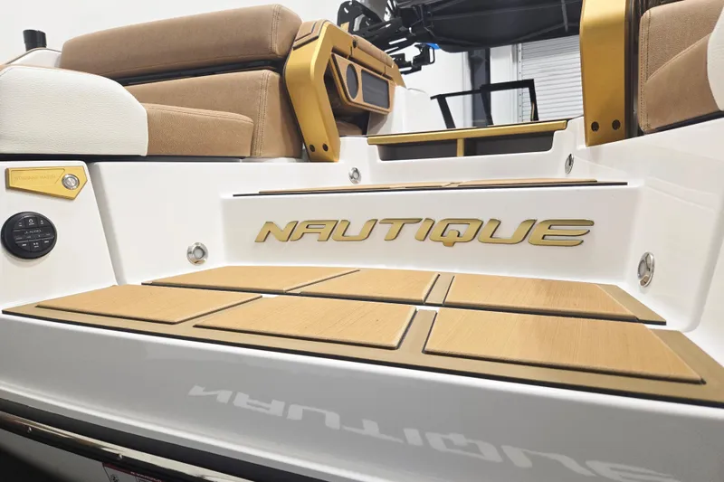 Slide: The Image of 2026 Nautique Super Air Nautique G23 Paragon boat interior with luxurious seating and branding. - 5