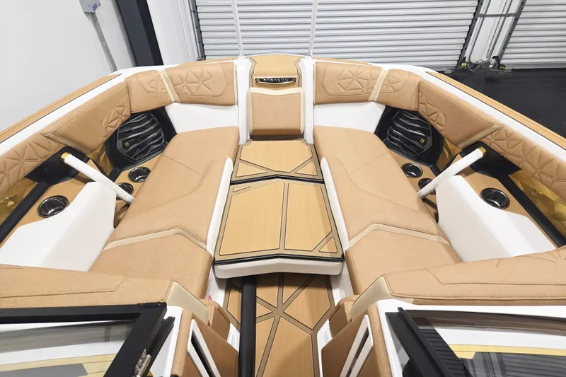 Slide: The Image of 2026 Nautique Super Air Nautique G23 Paragon interior with luxurious tan seating and modern design. - 9