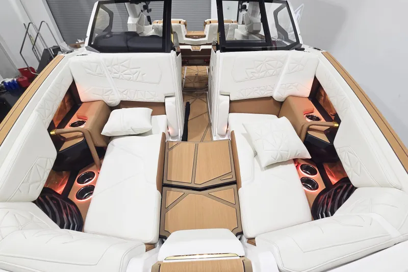 Slide: The Image of Luxurious interior of 2026 Nautique Super Air Nautique G23 Paragon boat with white seating. - 10