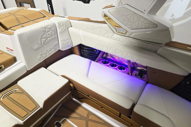 Slide: The Image of Luxurious interior of 2026 Nautique Super Air Nautique G23 Paragon with ambient lighting. - 17