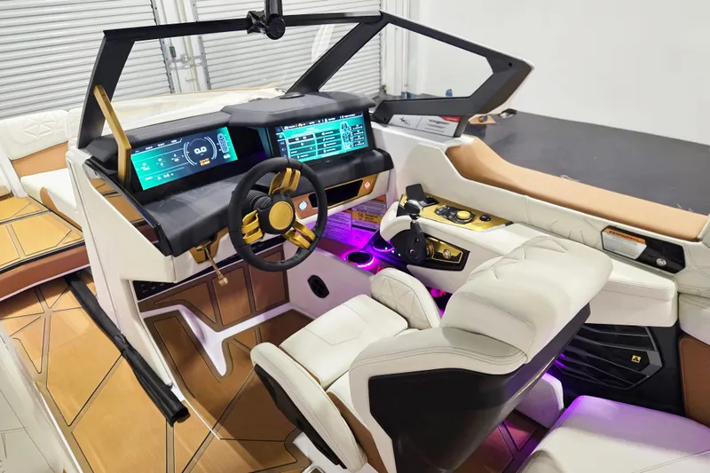 Slide: The Image of 2026 Nautique Super Air Nautique G23 Paragon cockpit with advanced digital displays and luxurious seating. - 15