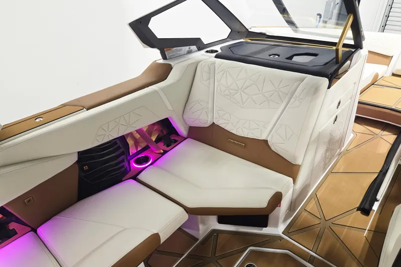 Slide: The Image of Luxurious interior of 2026 Nautique Super Air Nautique G23 Paragon with ambient lighting. - 14
