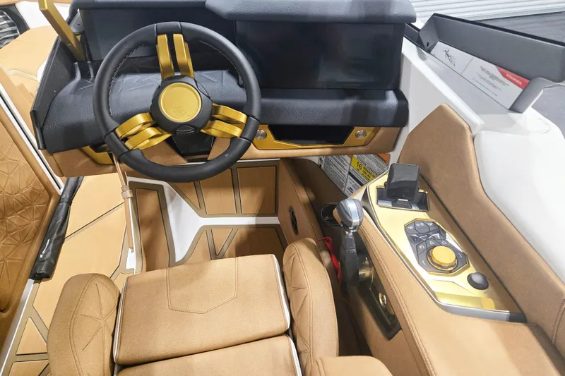 Slide: The Image of Interior of 2026 Nautique Super Air Nautique G23 Paragon with luxurious steering and controls. - 8