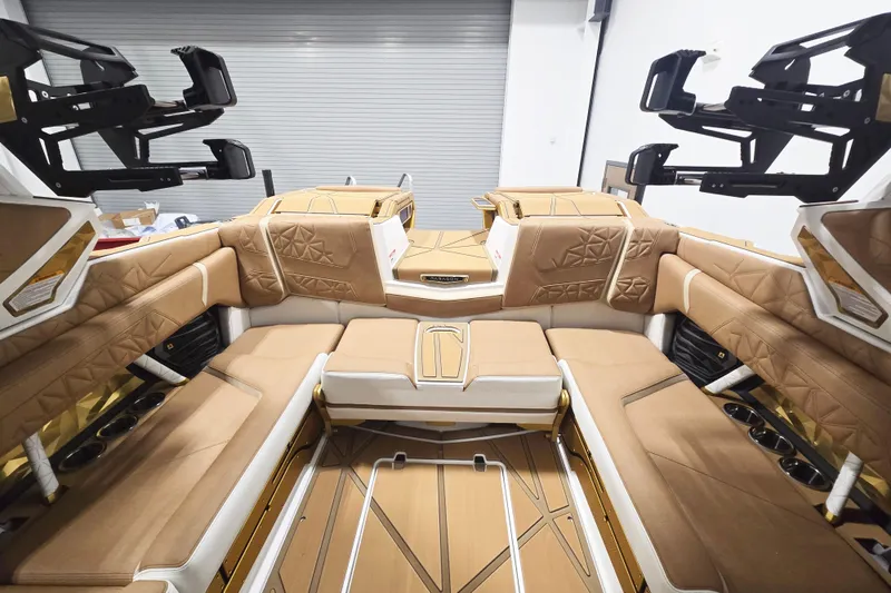 Slide: The Image of Luxurious interior of 2026 Nautique Super Air Nautique G23 Paragon boat with tan seating. - 7