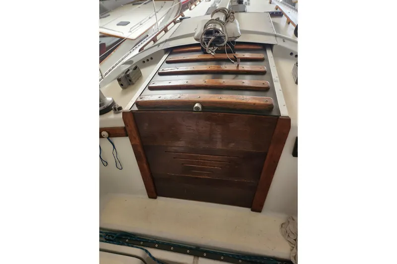 Slide: The Image of 1978 Columbia Yacht 10.7 cockpit with wooden hatch and rigging details. - 9