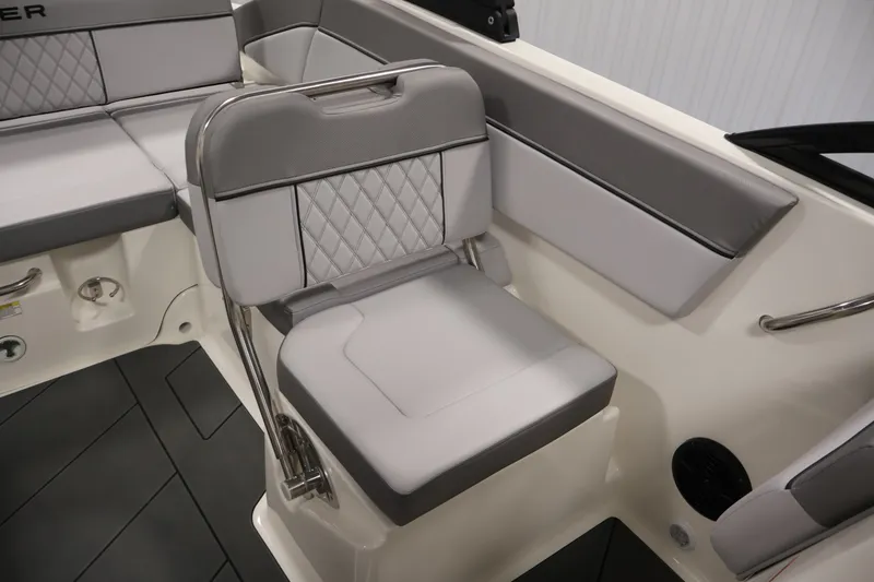 Slide: The Image of 2026 Bayliner D22I boat interior with gray cushioned seating and modern design. - 26