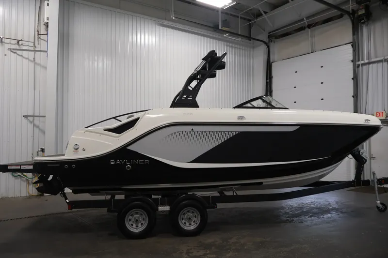 Slide: The Image of 2026 Bayliner D22I boat on trailer in indoor storage facility. - 3