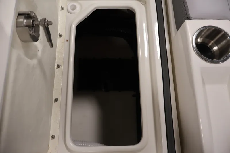 Slide: The Image of Storage compartment and cup holder on 2026 Bayliner D22I boat. - 37