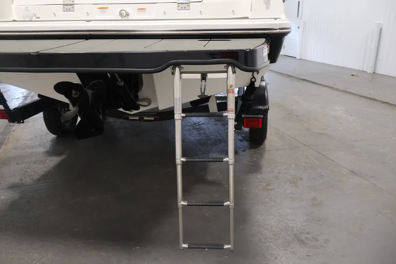 Slide: The Image of 2026 Bayliner D22I boat with ladder and propeller in a garage setting. - 41