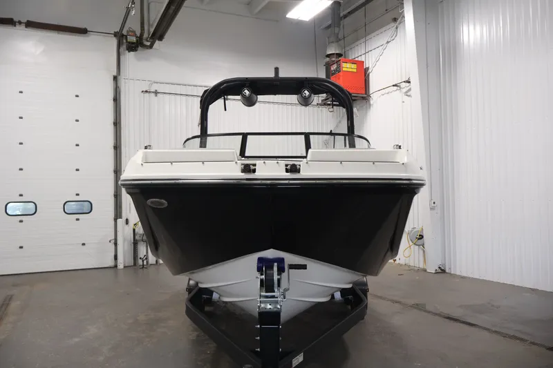 Slide: The Image of 2026 Bayliner D22I boat in indoor storage, front view. - 1