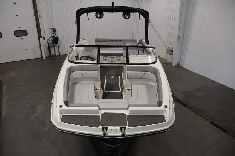 Slide: The Image of 2026 Bayliner D22I boat interior with sleek seating and modern design in a showroom. - 8