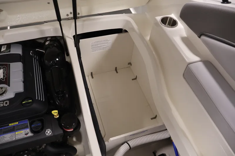 Slide: The Image of Engine compartment of 2026 Bayliner D22I boat, showcasing storage and engine details. - 34