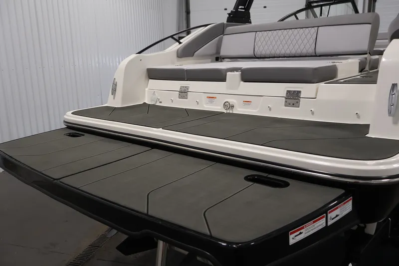 Slide: The Image of 2026 Bayliner D22I boat with spacious rear deck and cushioned seating. - 40