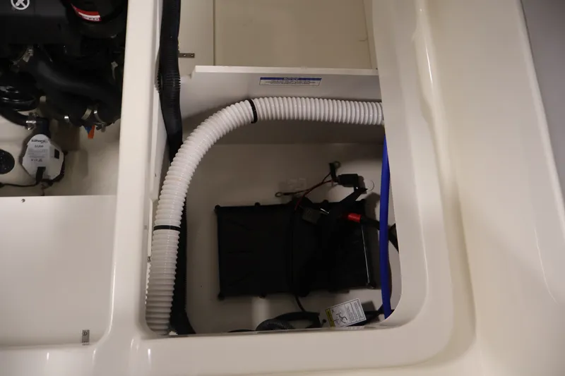 Slide: The Image of 2026 Bayliner D22I boat engine compartment with visible wiring and components. - 35