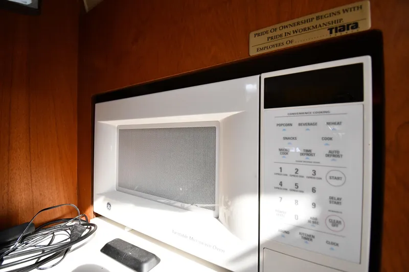 Slide: The Image of Microwave in 1998 Tiara Yachts 3100 Open, showcasing convenience cooking options. - 29