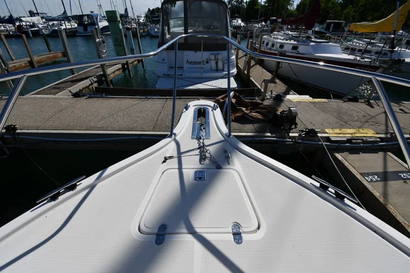 Slide: The Image of Bow view of a 1998 Tiara Yachts 3100 Open docked at a marina. - 4
