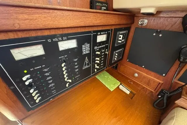 Slide: The Image of Electrical panel of a 1997 Island Packet 37 yacht, featuring 12V and 120V systems. - 20