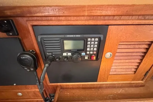 Slide: The Image of 1997 Island Packet 37 yacht radio panel with Icom VHF marine radio. - 21