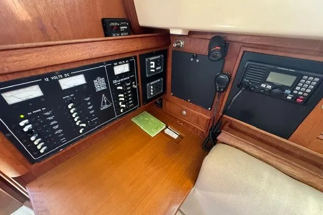 Slide: The Image of Control panel of a 1997 Island Packet 37 sailboat with navigation and communication equipment. - 22
