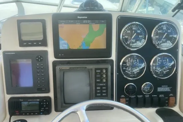 Slide: The Image of Dashboard of a 2003 Pursuit 3000 Express boat with navigation and control instruments. - 22