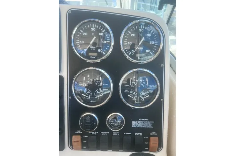 Slide: The Image of Dashboard of a 2003 Pursuit 3000 Express boat with gauges and controls. - 23