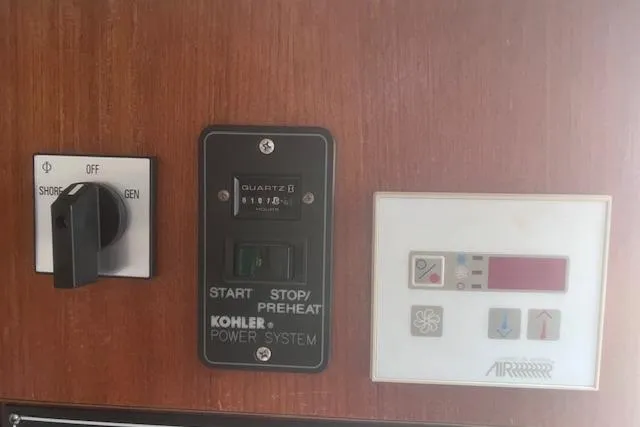 Slide: The Image of Control panel of a 2003 Pursuit 3000 Express boat with Kohler power system. - 29
