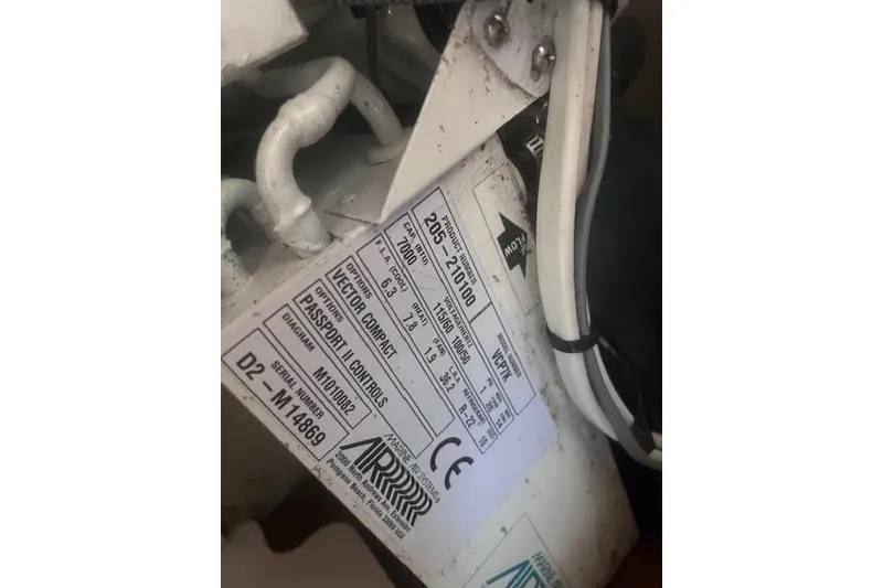 Slide: The Image of Label on a 2003 Pursuit 3000 Express boat, showing technical specifications and serial number. - 31