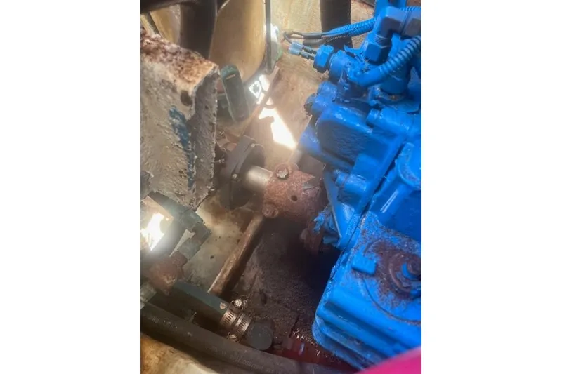 Slide: The Image of Engine compartment of a 2003 Pursuit 3000 Express boat, showing mechanical components. - 35