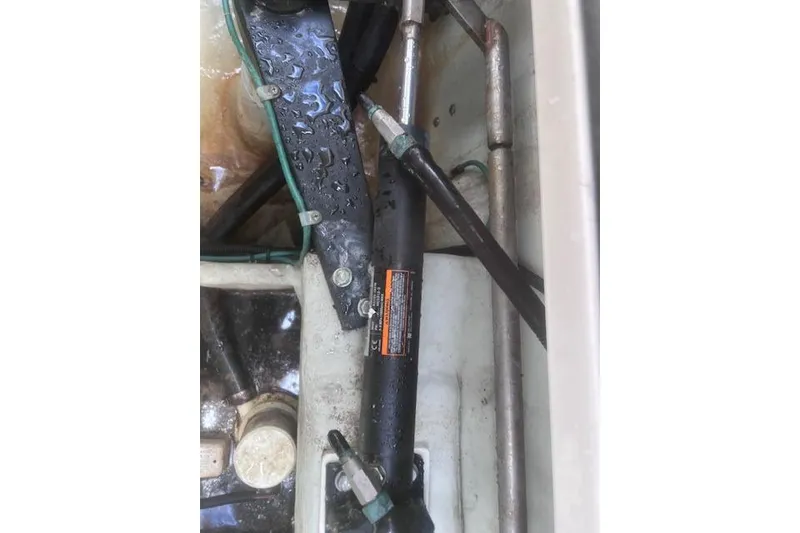 Slide: The Image of Hydraulic system components in a 2003 Pursuit 3000 Express boat engine compartment. - 40