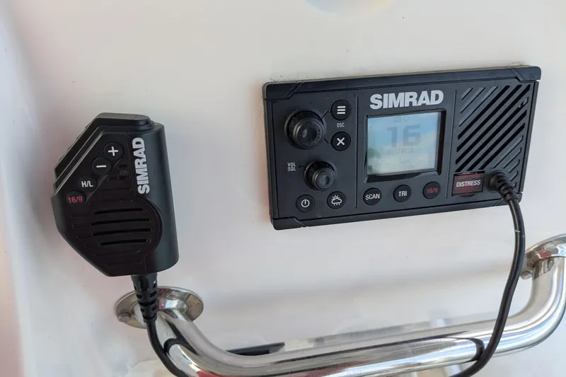Slide: The Image of Simrad marine radio system on a 2016 Brig E780 boat dashboard. - 10