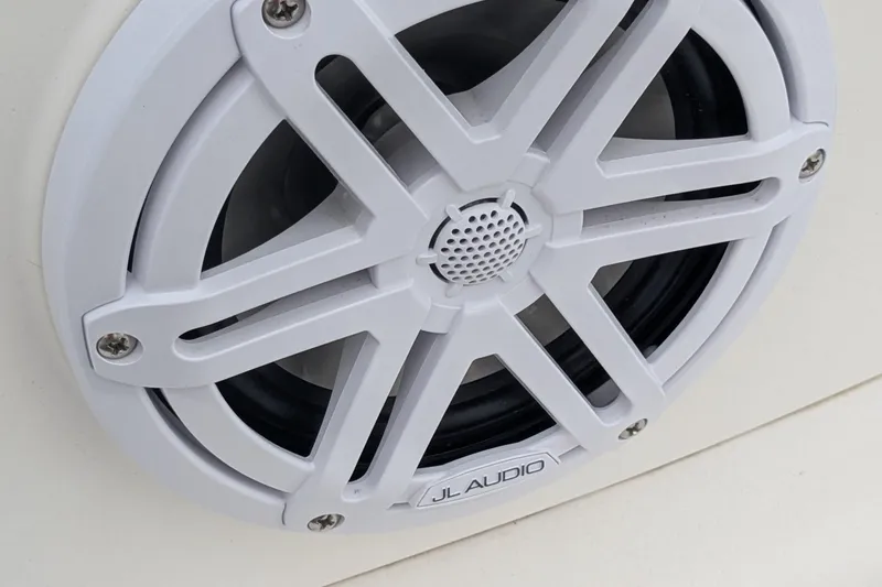 Slide: The Image of White JL Audio speaker on a 2016 Brig E780 boat. - 22