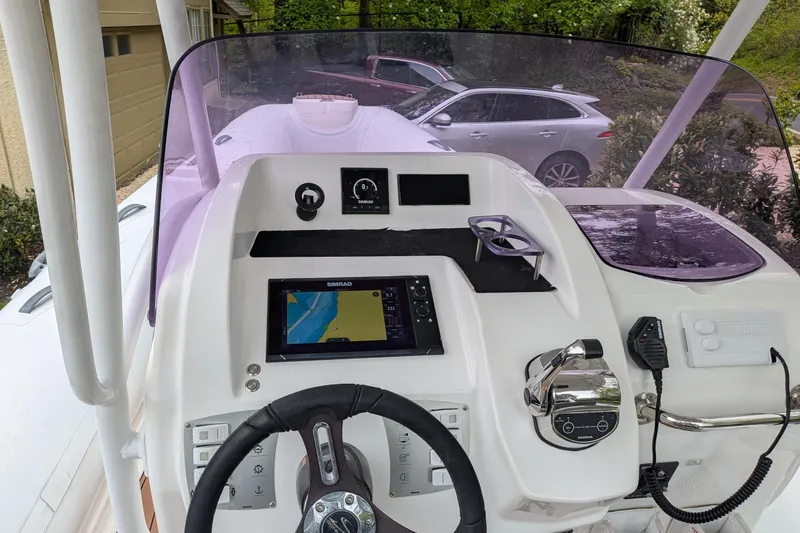 Slide: The Image of 2016 Brig E780 boat dashboard with navigation system and steering wheel. - 7