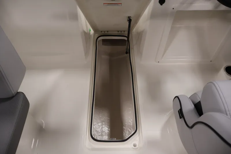 Slide: The Image of 2026 Bayliner VR4 Bowrider OB interior storage compartment, featuring sleek design and ample space. - 26