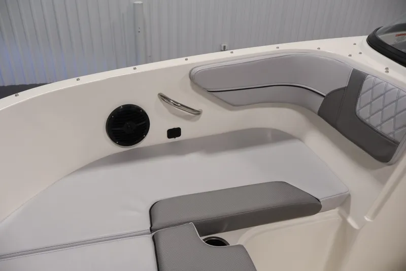 Slide: The Image of Interior seating of 2026 Bayliner VR4 Bowrider OB with speaker and cup holder. - 14