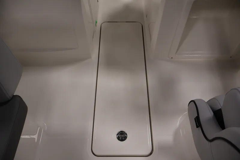 Slide: The Image of 2026 Bayliner VR4 Bowrider OB interior floor storage compartment. - 25