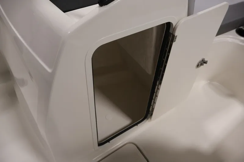 Slide: The Image of 2026 Bayliner VR4 Bowrider OB storage compartment with open door, showcasing interior space. - 28