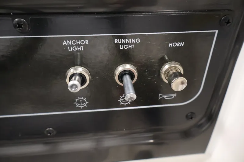 Slide: The Image of Control panel of 2026 Bayliner VR4 Bowrider OB with switches for anchor light, running light, and horn. - 21