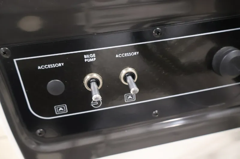 Slide: The Image of Control panel of 2026 Bayliner VR4 Bowrider OB with bilge pump and accessory switches. - 20