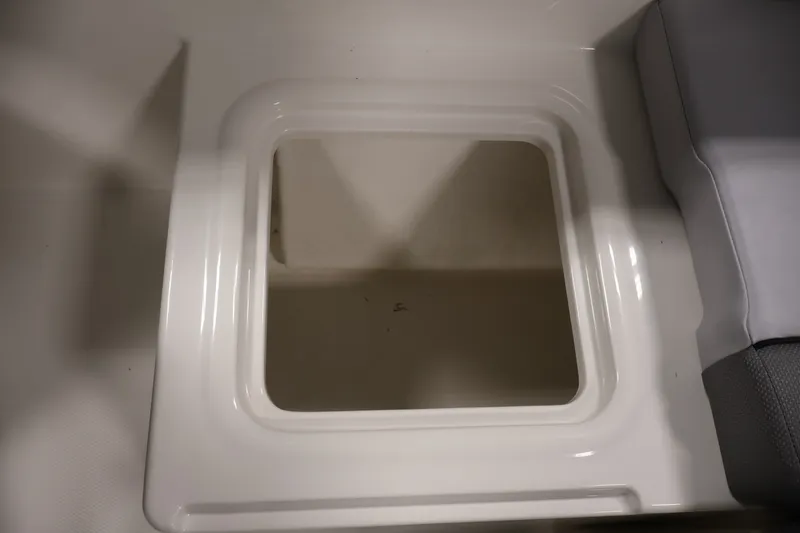 Slide: The Image of 2026 Bayliner VR4 Bowrider OB storage compartment detail. - 32