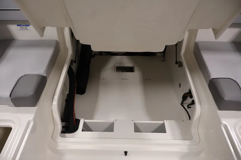 Slide: The Image of 2026 Bayliner VR4 Bowrider OB interior storage compartment with seating. - 33