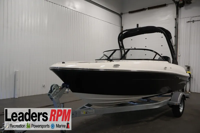 The Image of 2026 Bayliner VR4 Bowrider OB on trailer in indoor showroom. - 0