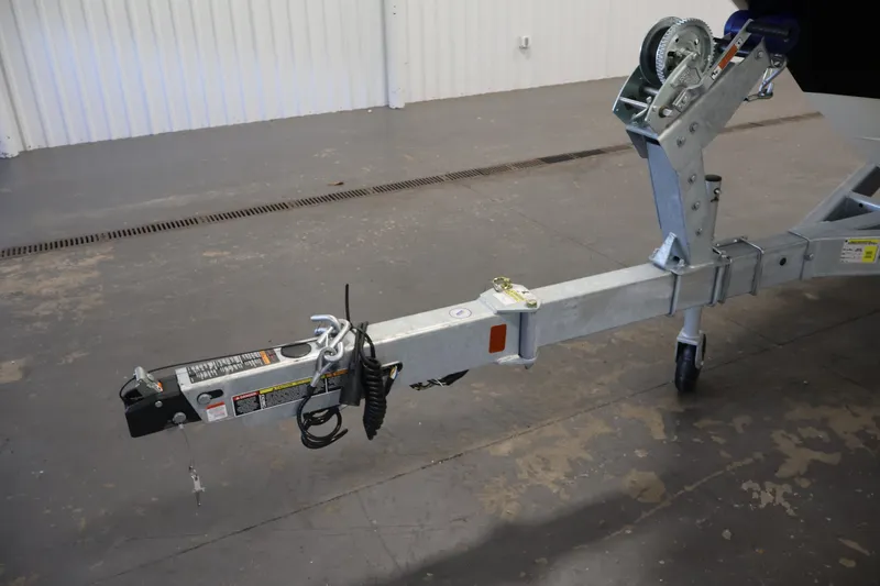 Slide: The Image of Trailer hitch of 2026 Bayliner VR4 Bowrider OB in a garage setting. - 35