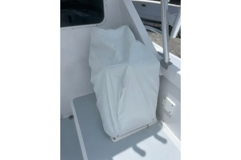 Slide: The Image of Covered seat on a 1973 Bertram 31 Flybridge Cruiser boat deck. - 31