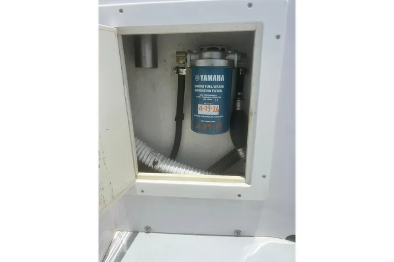 Slide: The Image of Yamaha marine fuel filter in a 1973 Bertram 31 Flybridge Cruiser compartment. - 16