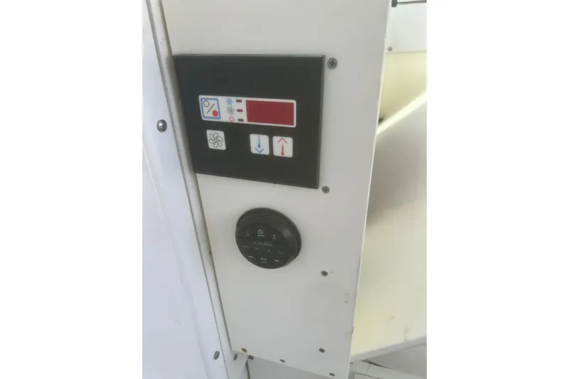 Slide: The Image of Control panel on a 1973 Bertram 31 Flybridge Cruiser boat interior. - 30