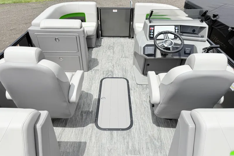 Slide: The Image of 2026 Qwest E-Class RLS 18 pontoon boat interior with modern seating and steering console. - 10
