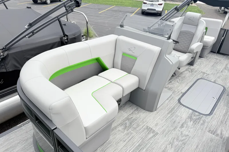 Slide: The Image of 2026 Qwest E-Class RLS 18 pontoon boat interior with modern seating and sleek design. - 13