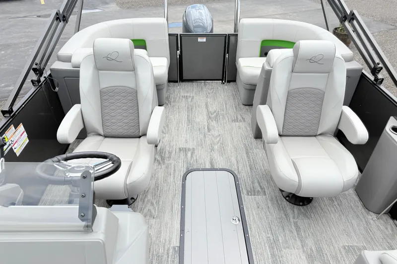 Slide: The Image of 2026 Qwest E-Class RLS 18 boat interior with luxurious seating and modern design. - 16